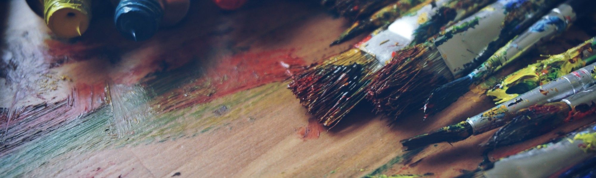 Dirty paint brushes with various colors