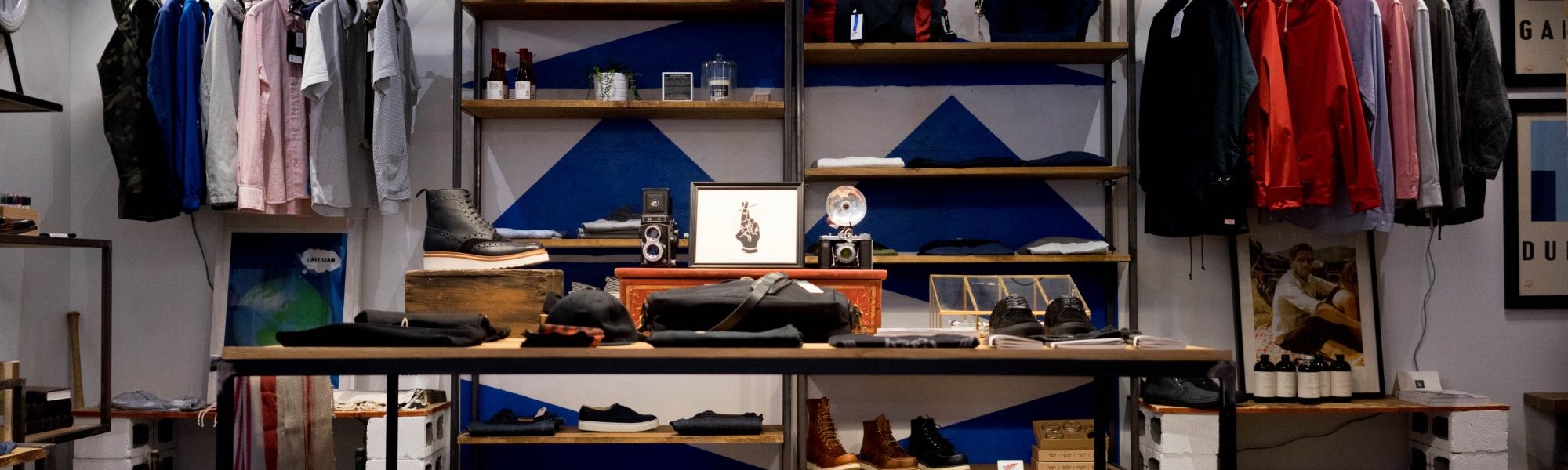 Retail display rack with folded and hanging clothing